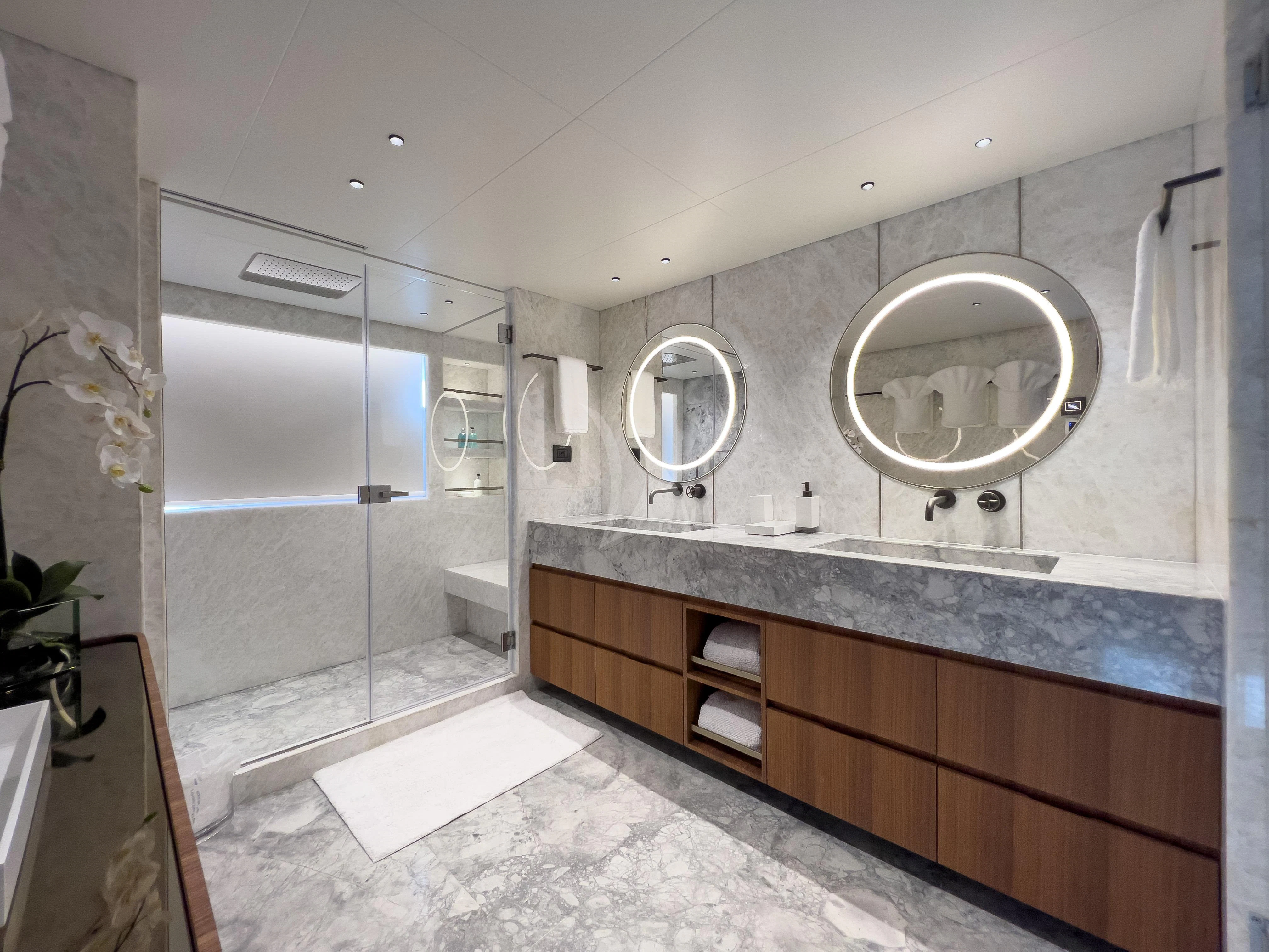 a bathroom with a large mirror aboard RISING DAWN Yacht for Sale