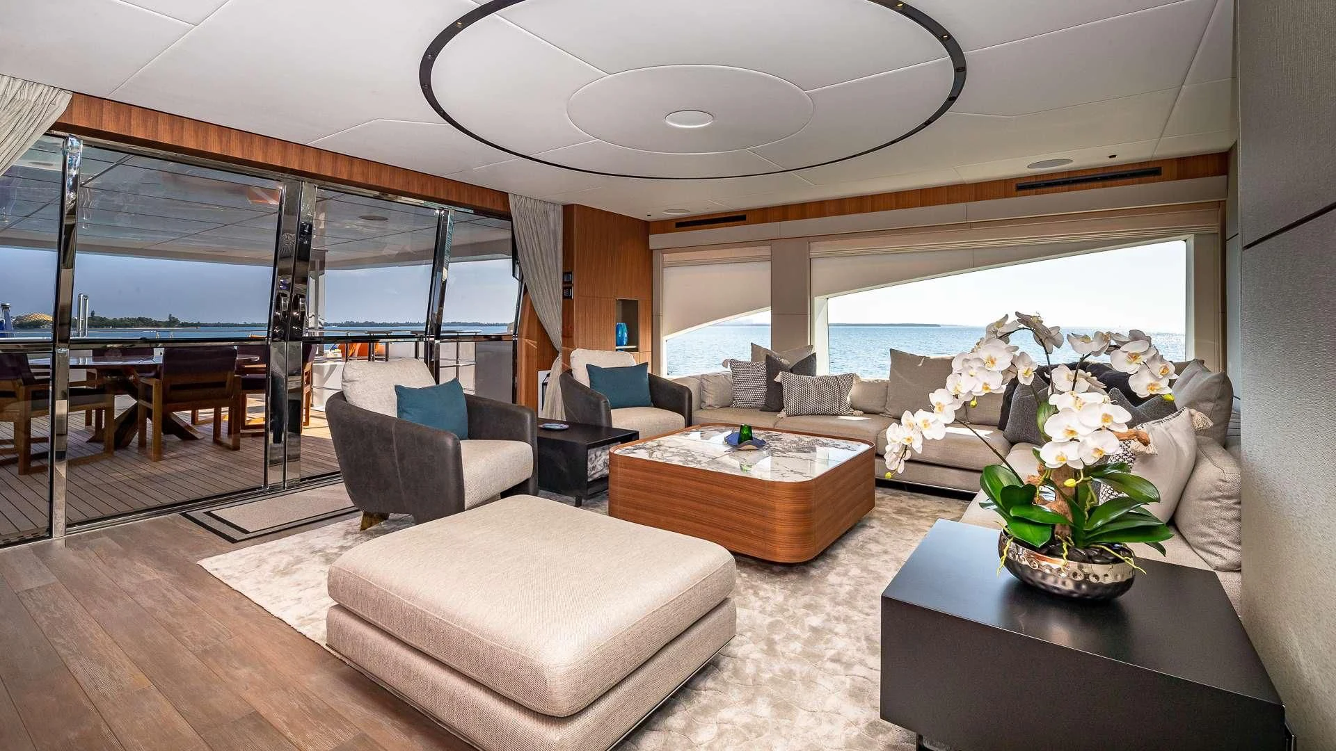 a living room with a large window aboard RISING DAWN Yacht for Sale