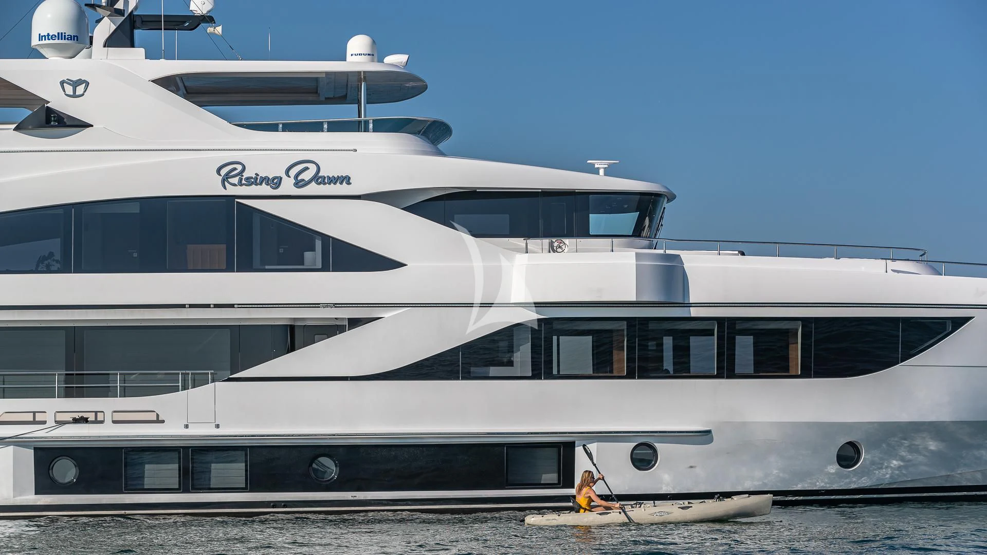 a white yacht on the water aboard RISING DAWN Yacht for Sale