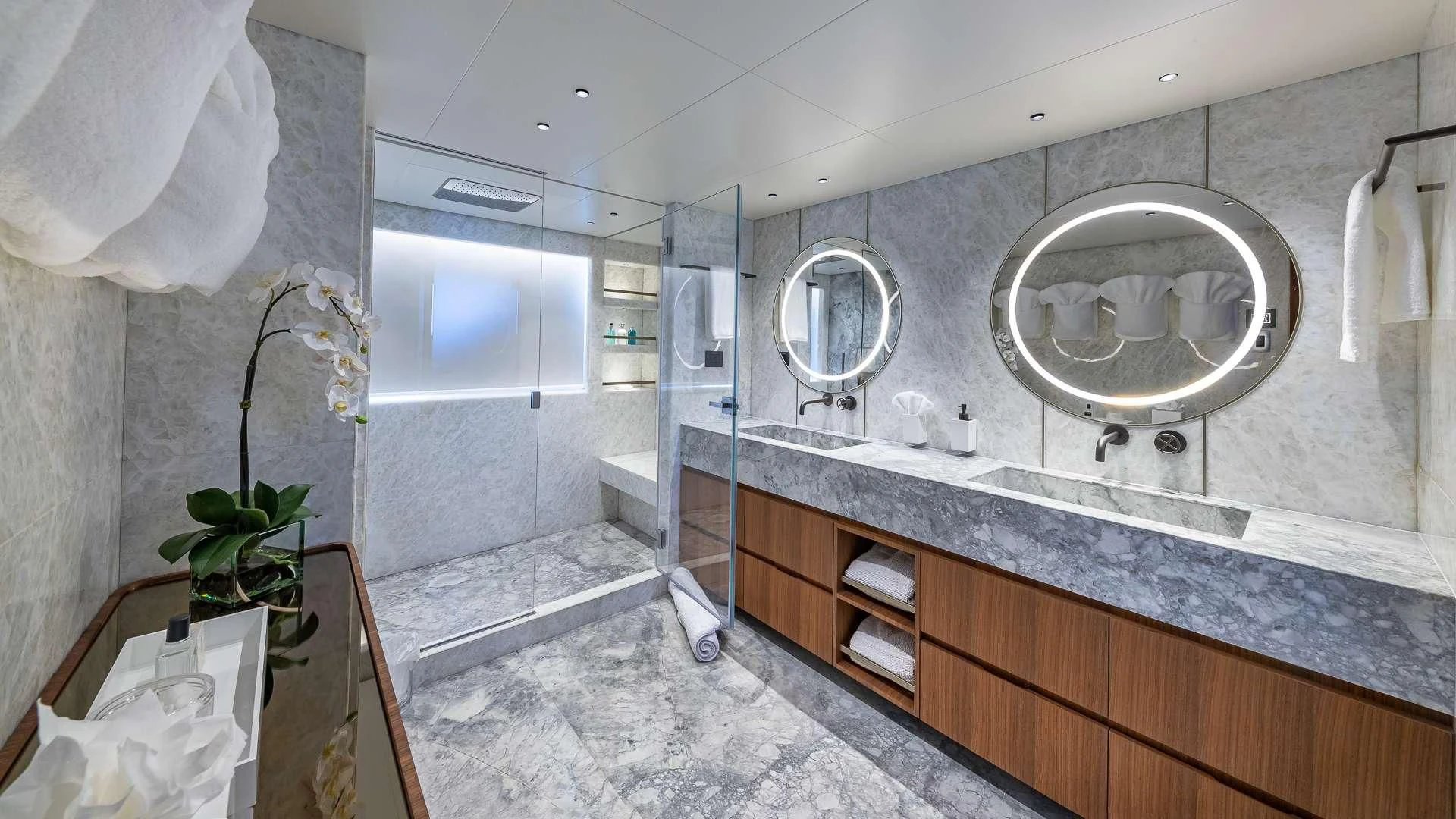a bathroom with a large mirror aboard RISING DAWN Yacht for Sale