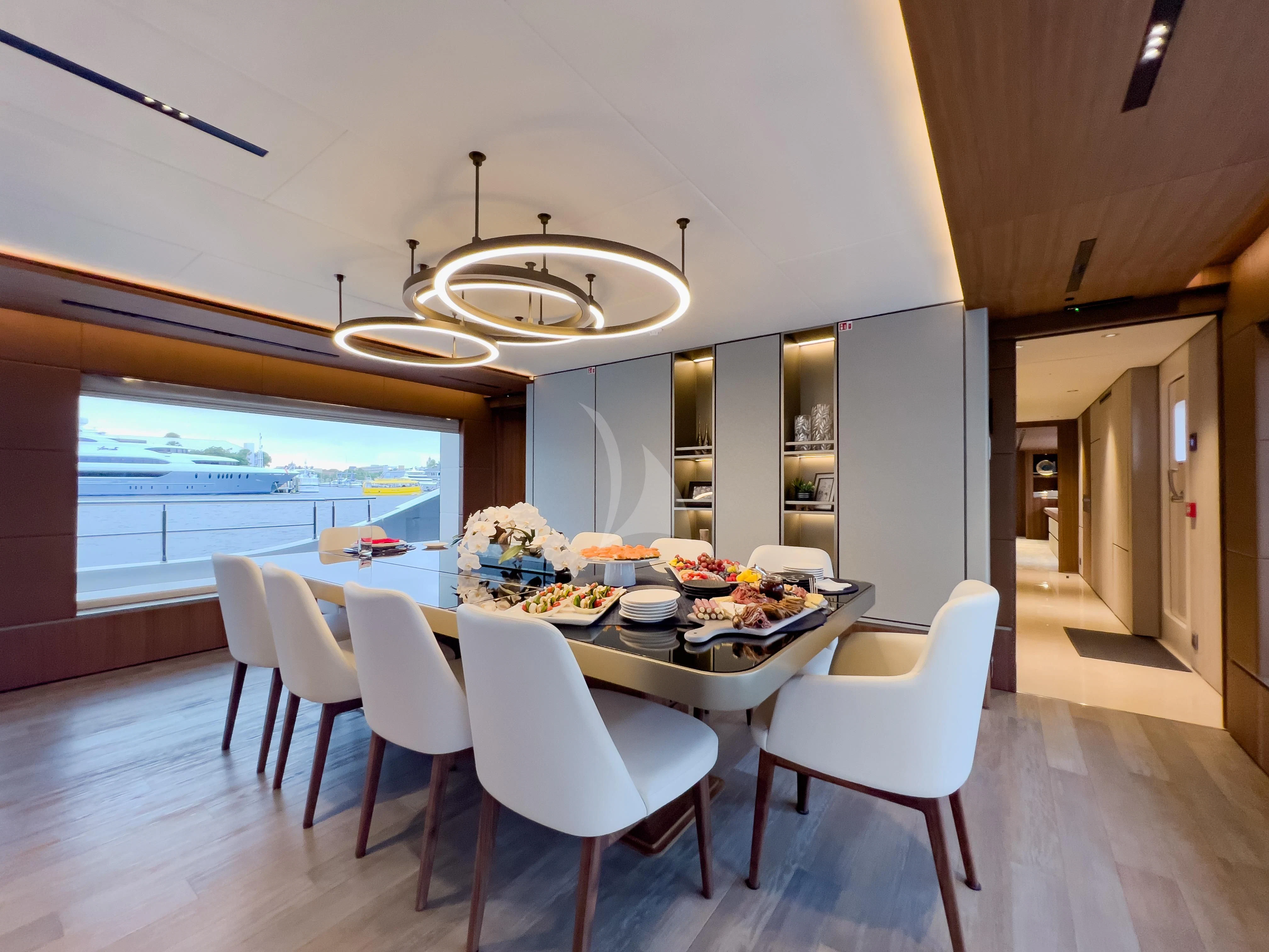 a large kitchen with a dining table aboard RISING DAWN Yacht for Sale