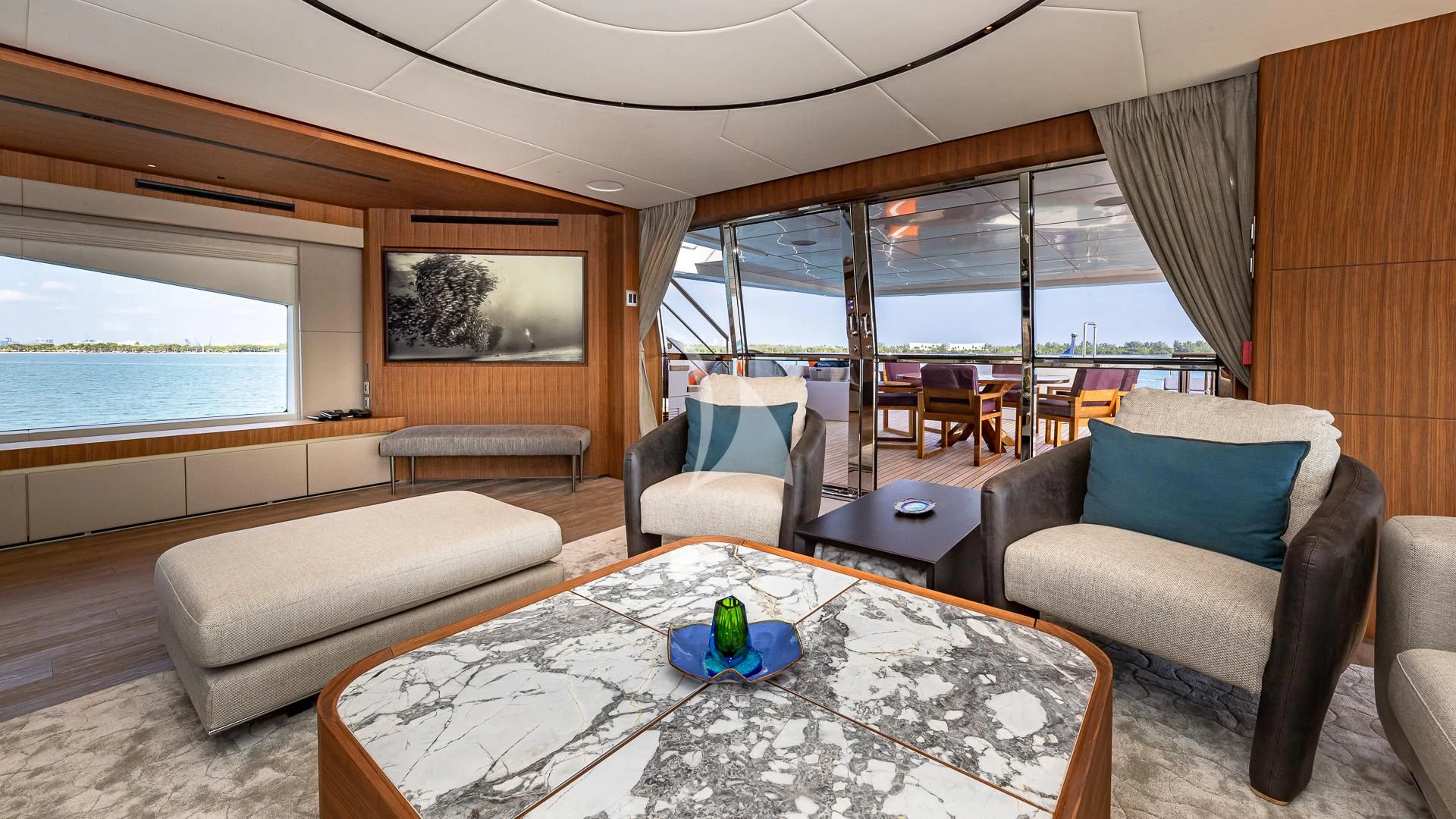 a living room with a large window aboard RISING DAWN Yacht for Sale