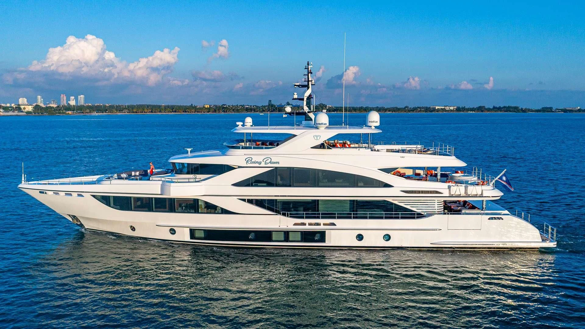 a white yacht in the water aboard RISING DAWN Yacht for Sale