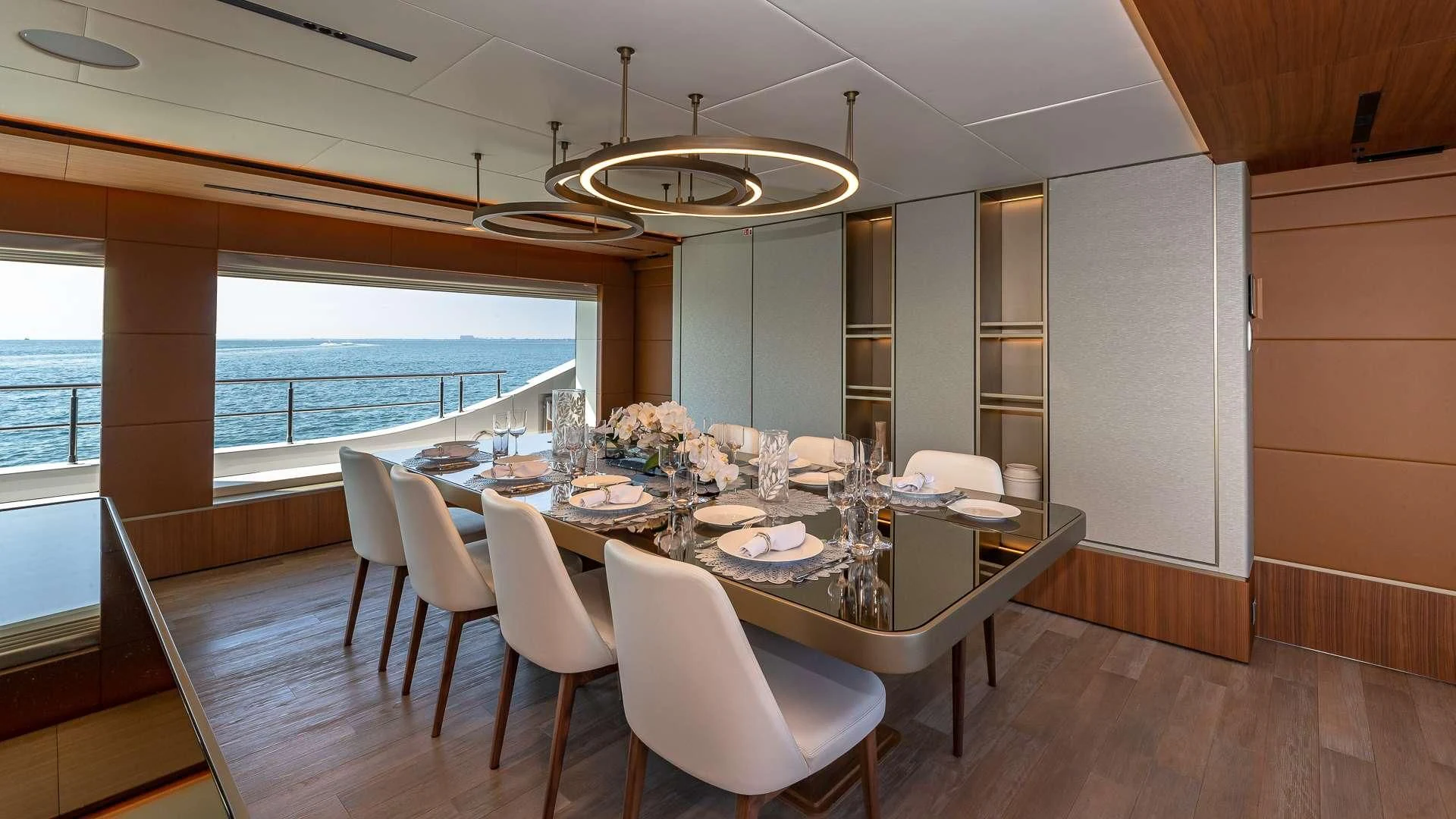 a dining room with a large table aboard RISING DAWN Yacht for Sale