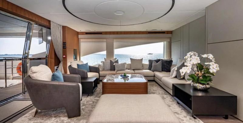 a living room with a large window aboard RISING DAWN Yacht for Sale