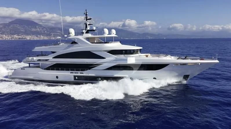 a white yacht on the water aboard RISING DAWN Yacht for Sale