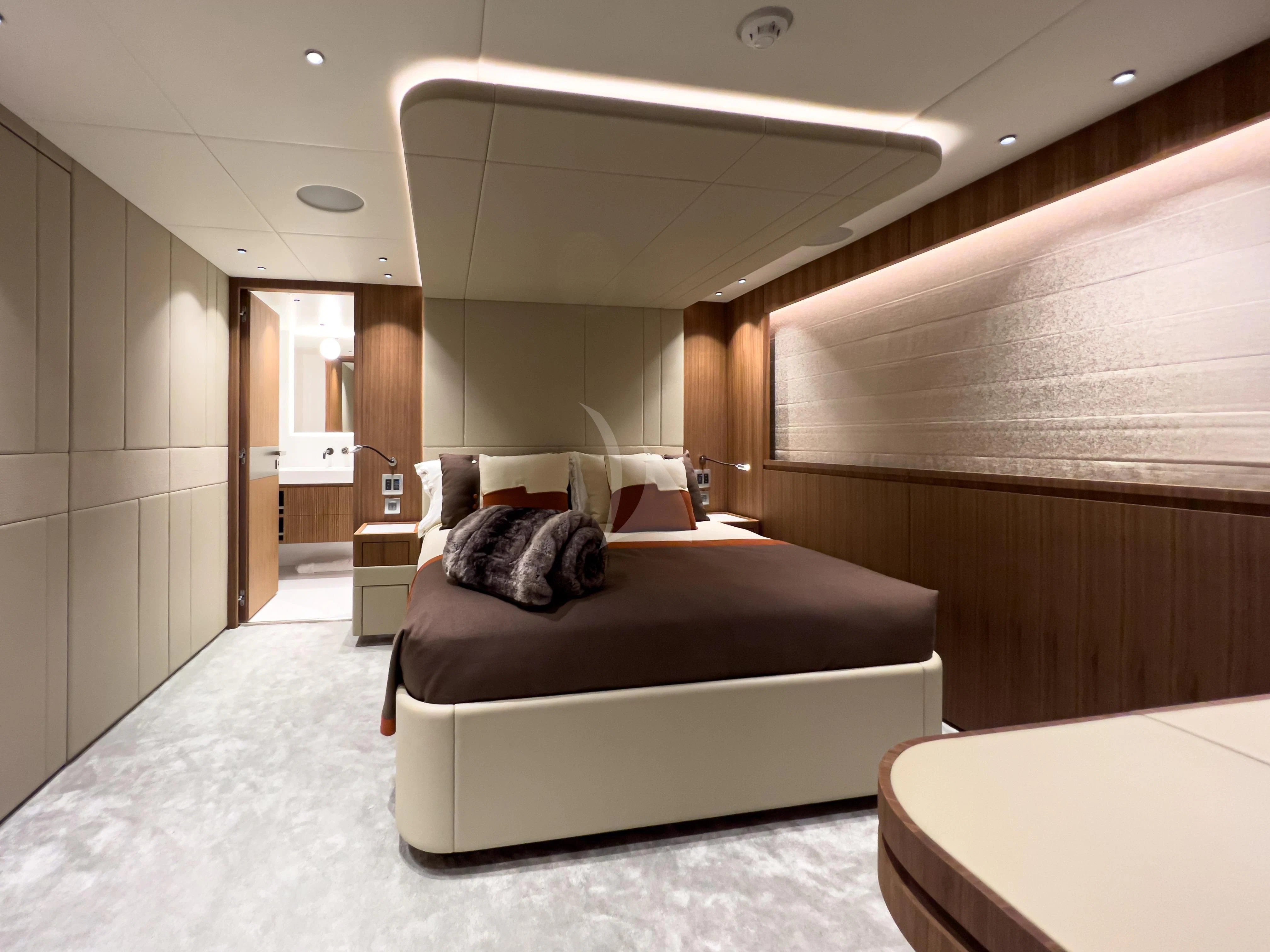 a bedroom with a bed aboard RISING DAWN Yacht for Sale