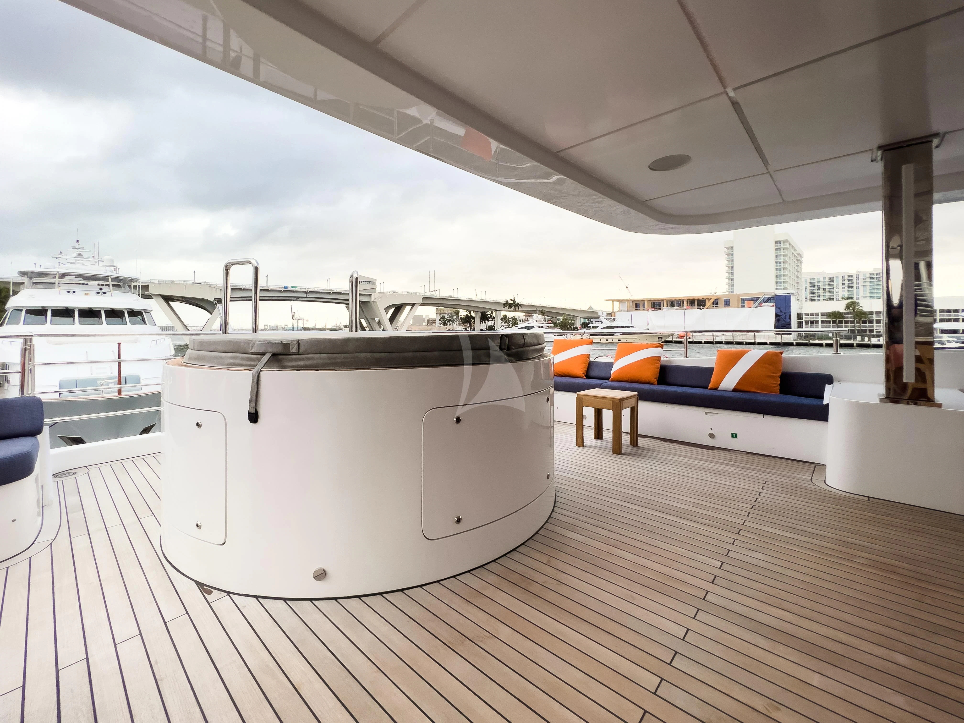a large white boat sits on a dock aboard RISING DAWN Yacht for Sale