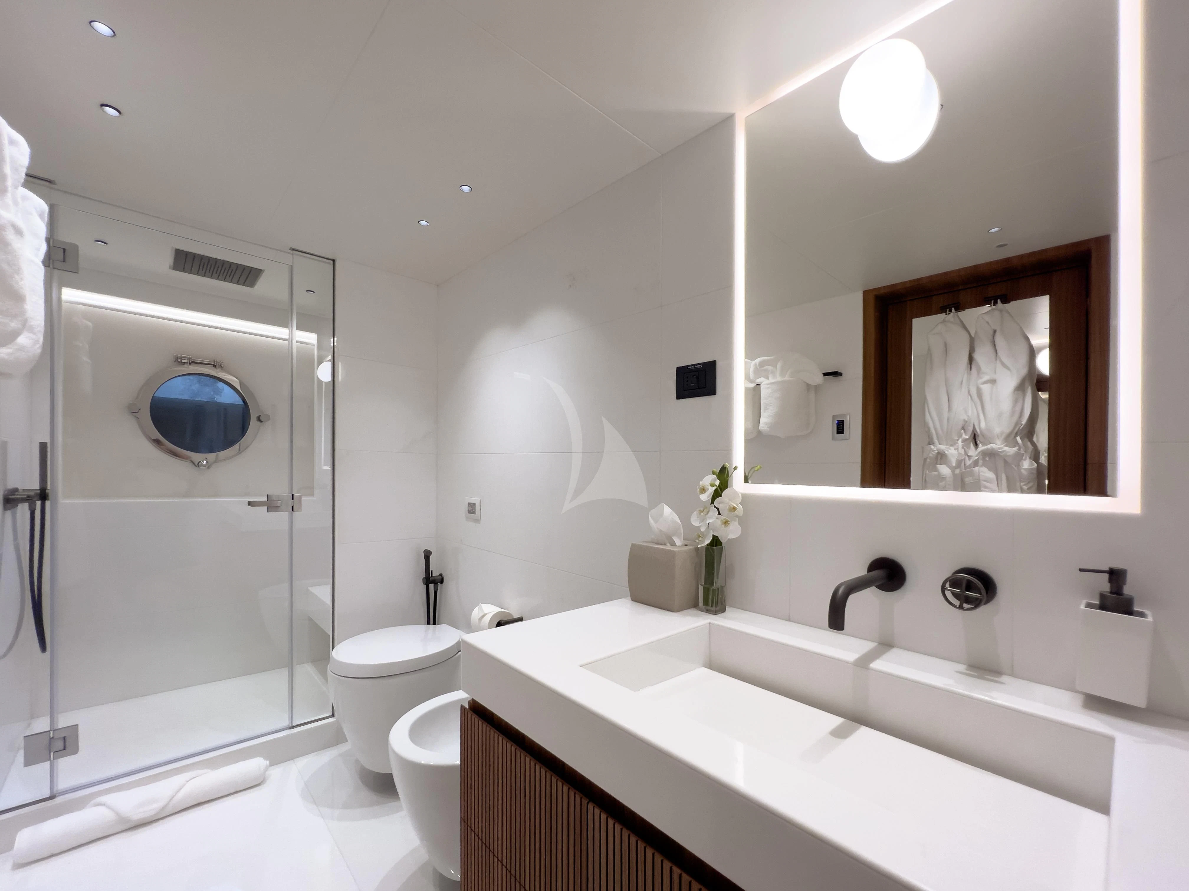 a bathroom with a large mirror aboard RISING DAWN Yacht for Sale