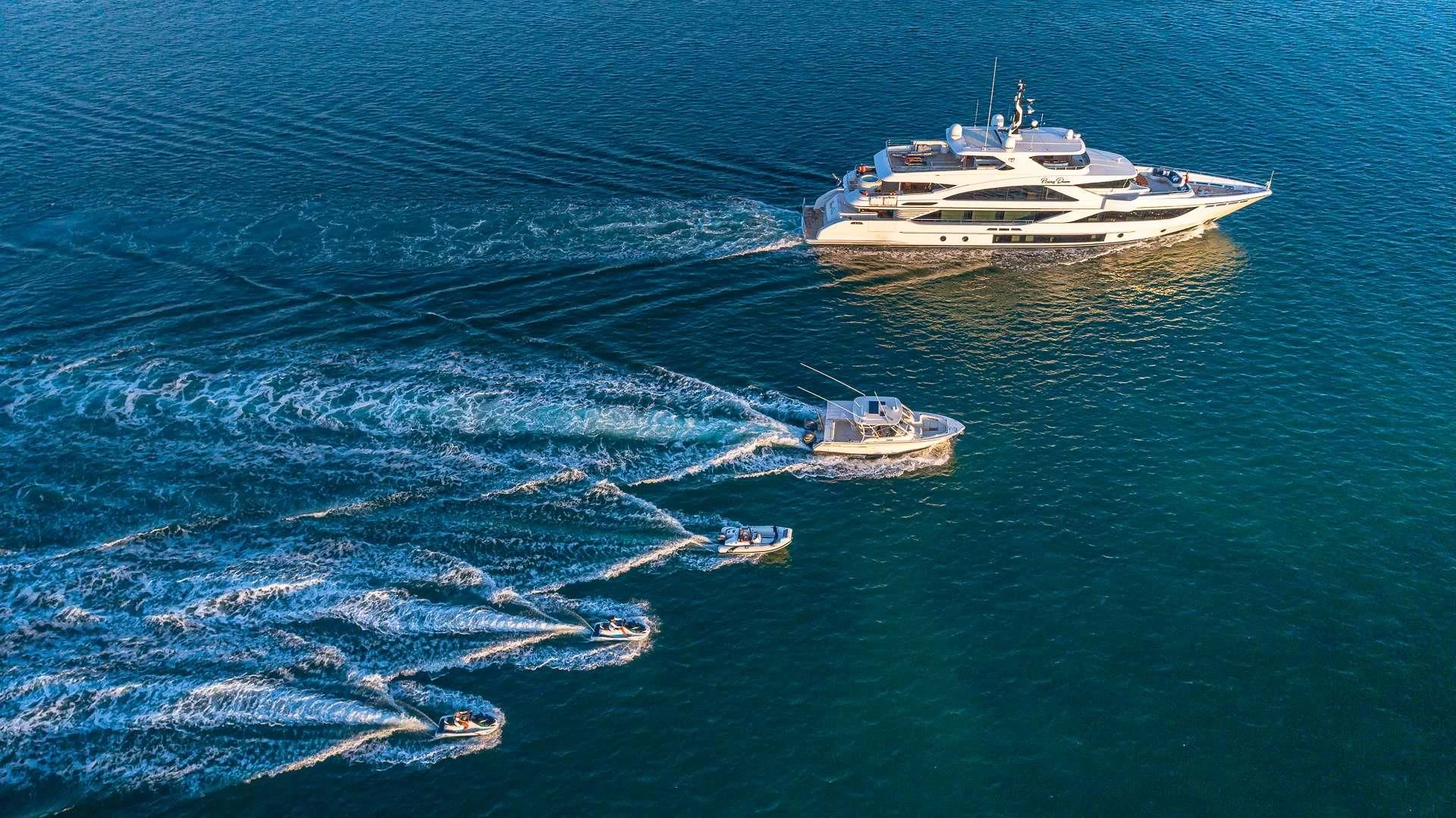 a couple of boats in the ocean aboard RISING DAWN Yacht for Sale