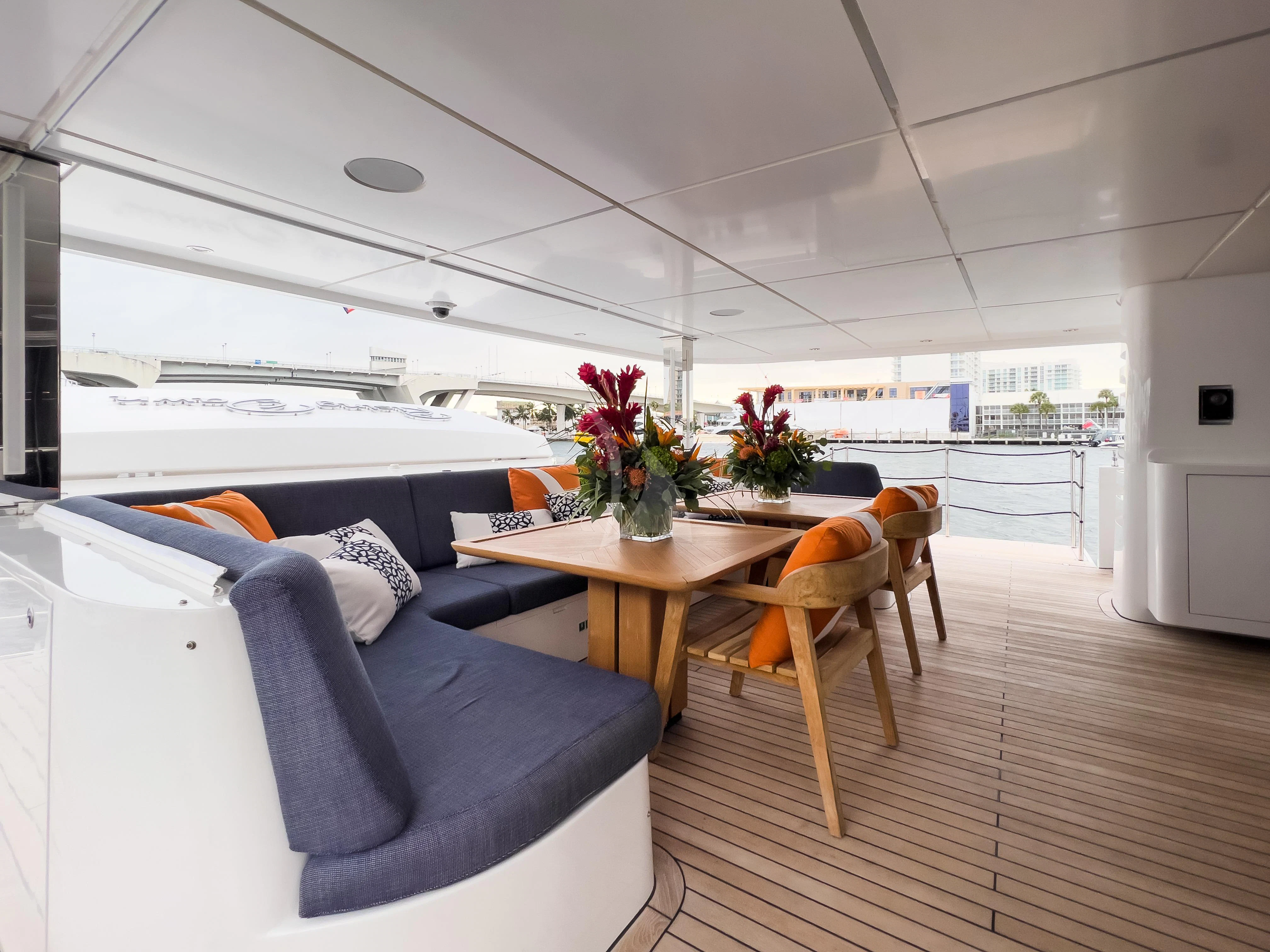 a living room with a table and chairs aboard RISING DAWN Yacht for Sale