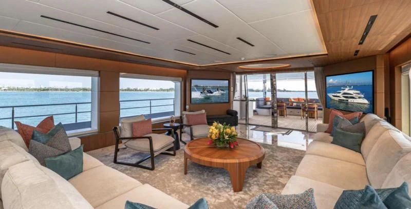 a living room with a large window aboard RISING DAWN Yacht for Sale