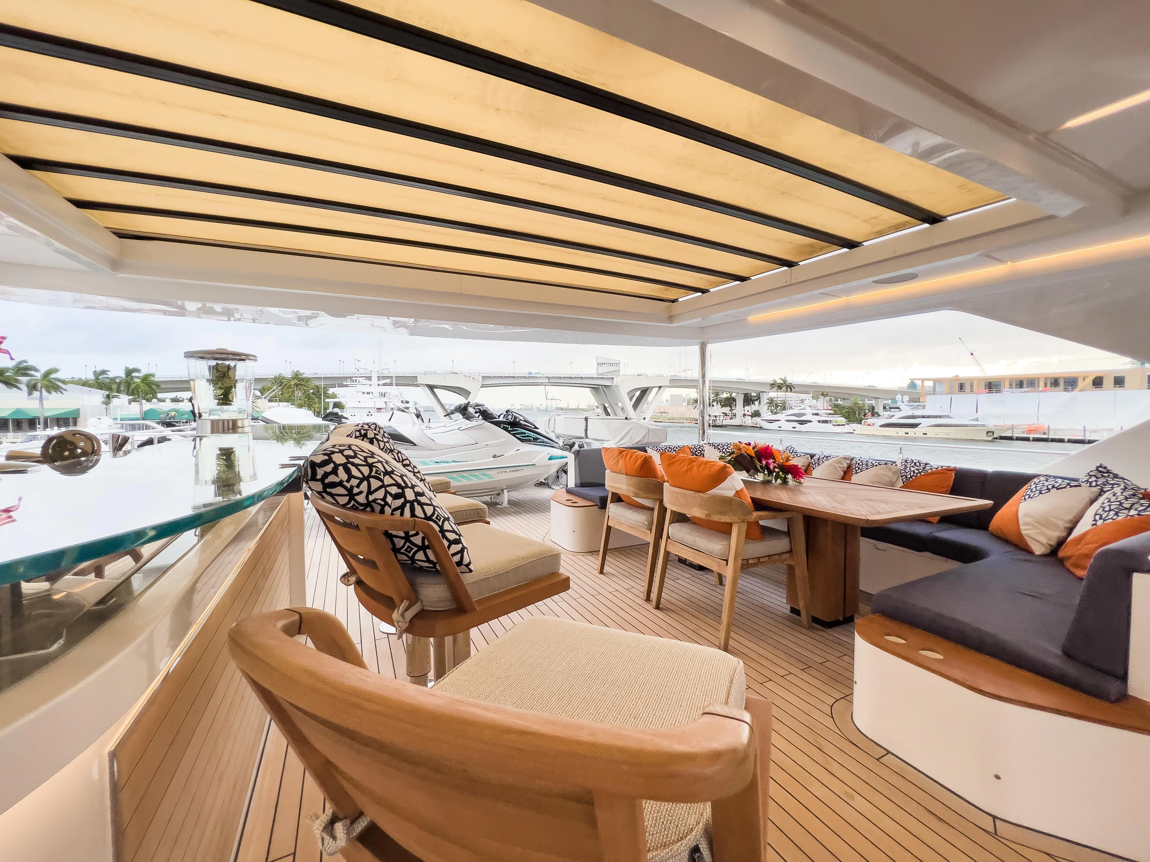 a room with a couch and a table and chairs aboard RISING DAWN Yacht for Sale