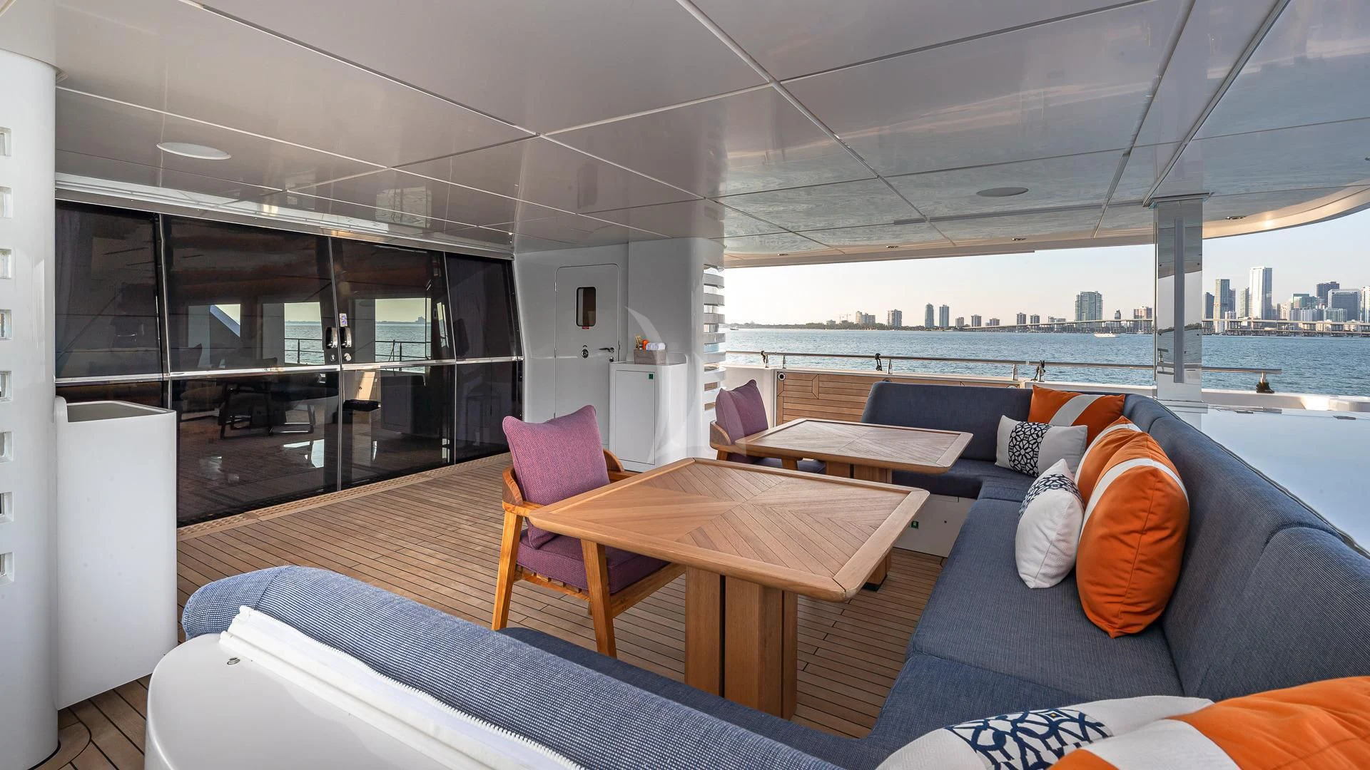 a living room with a couch and a table aboard RISING DAWN Yacht for Sale