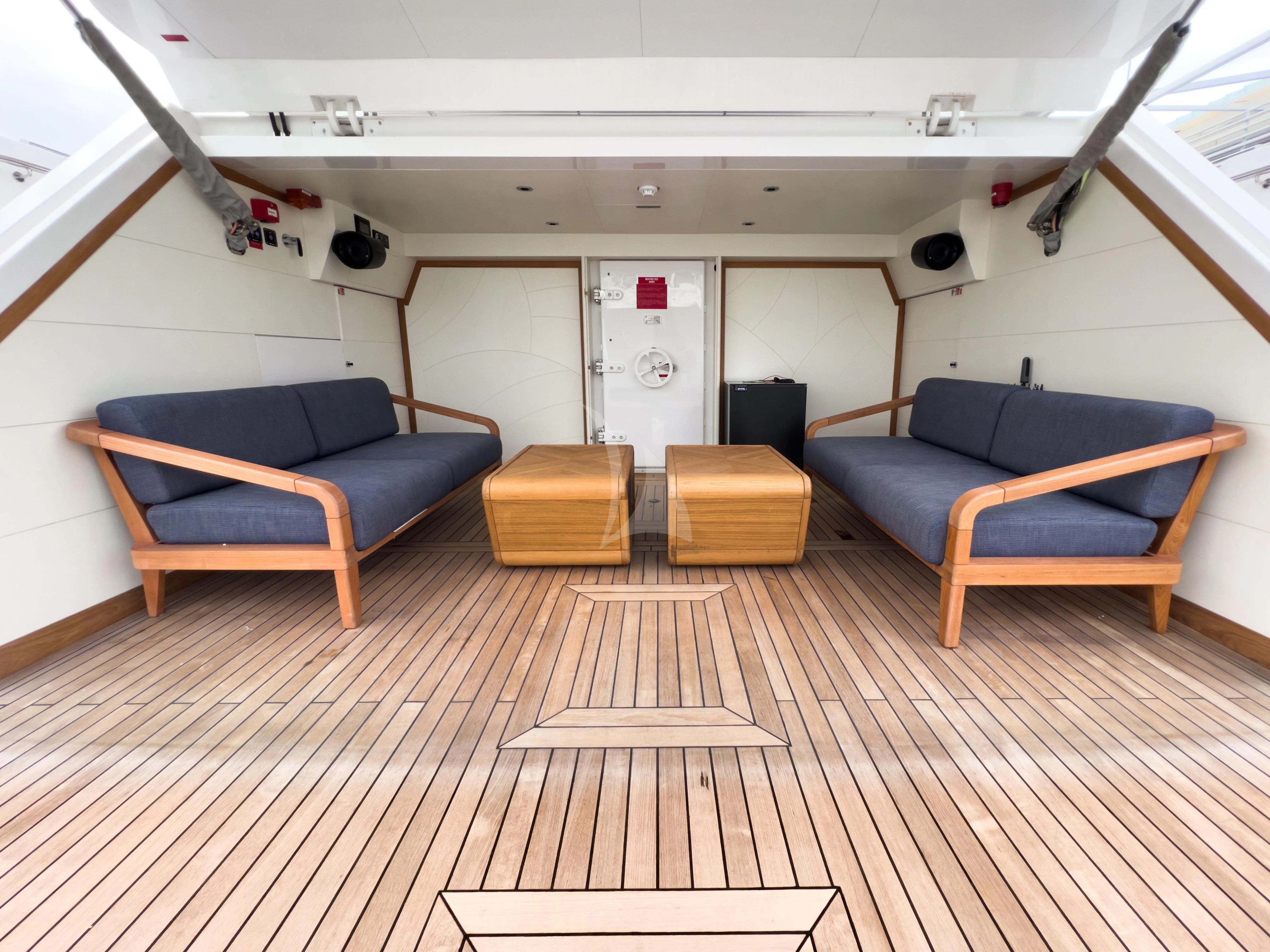 a room with a wood floor and a couch and a wood floor aboard RISING DAWN Yacht for Sale