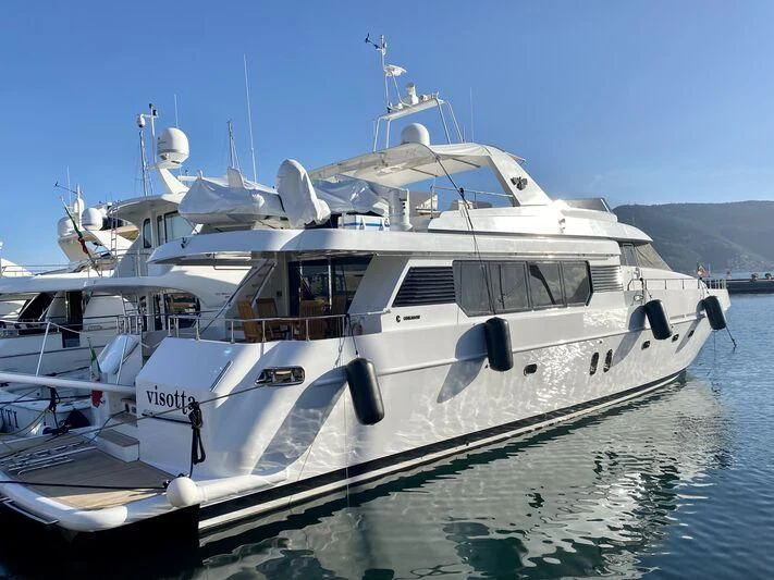 a white yacht on the water aboard VISOTTA Yacht for Sale