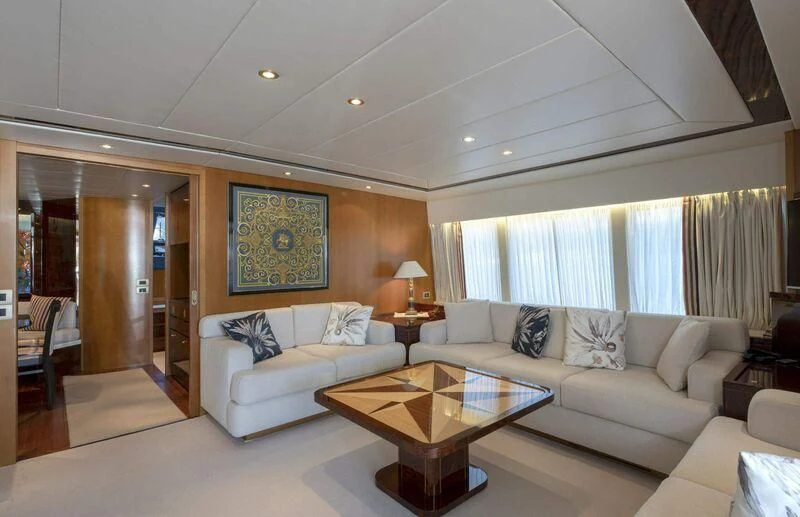 a living room with a couch and a table aboard VISOTTA Yacht for Sale