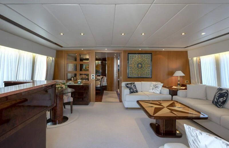 a living room with a couch and a coffee table aboard VISOTTA Yacht for Sale