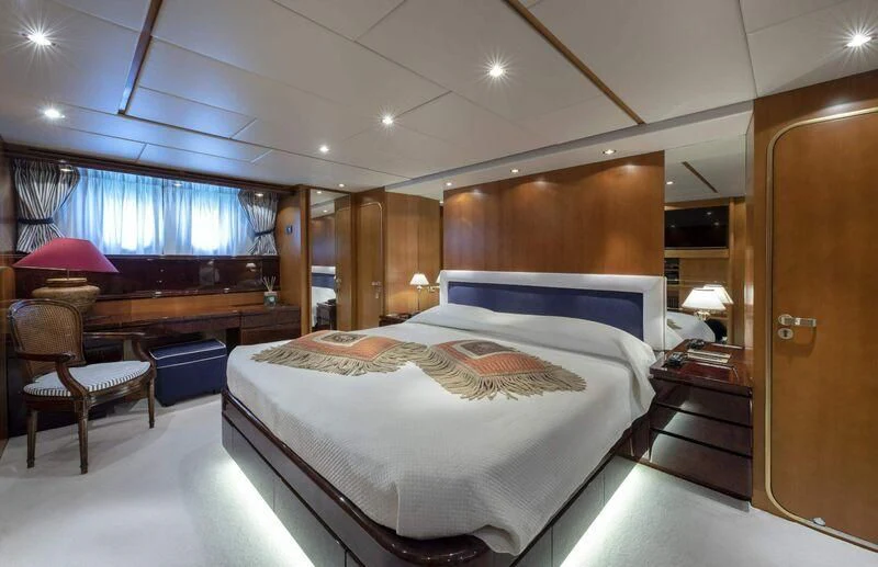 a large bedroom with a bed aboard VISOTTA Yacht for Sale