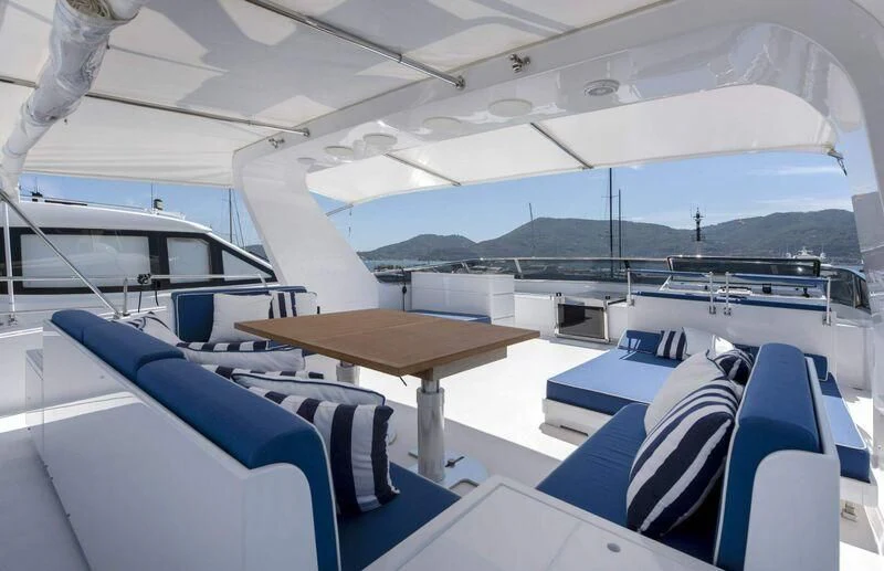 a boat with a table and chairs aboard VISOTTA Yacht for Sale