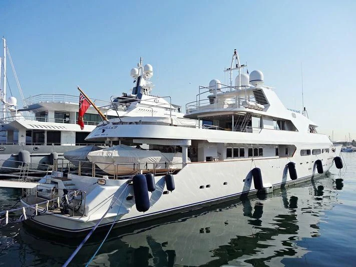 a boat docked at a pier aboard ACHILLES Yacht for Sale