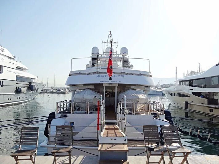 a boat docked at a pier aboard ACHILLES Yacht for Sale