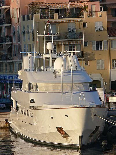 a large white boat in a harbor aboard ACHILLES Yacht for Sale