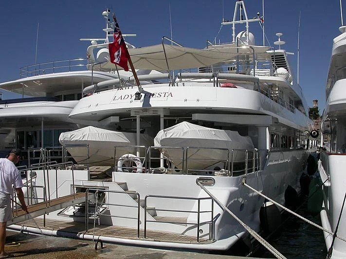 a boat with a flag on the front aboard ACHILLES Yacht for Sale