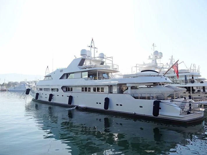 a couple of large white boats in a harbor aboard ACHILLES Yacht for Sale