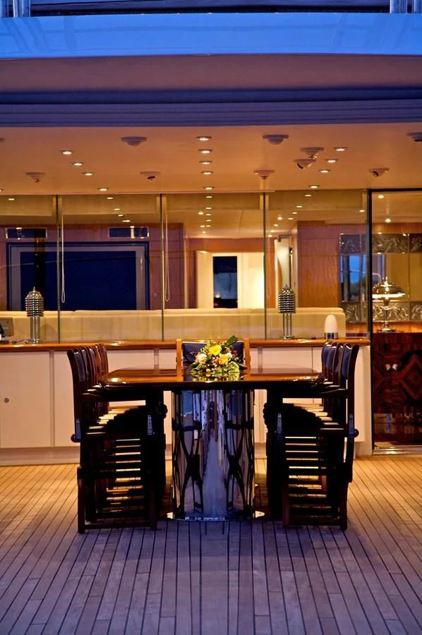 a room with a table and chairs aboard ACHILLES Yacht for Sale