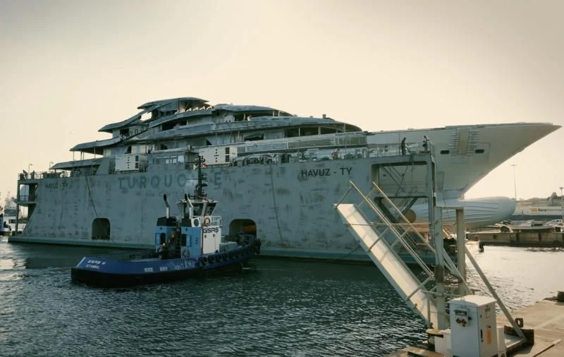 a large cruise ship docked aboard ANGELIQUE Yacht for Sale