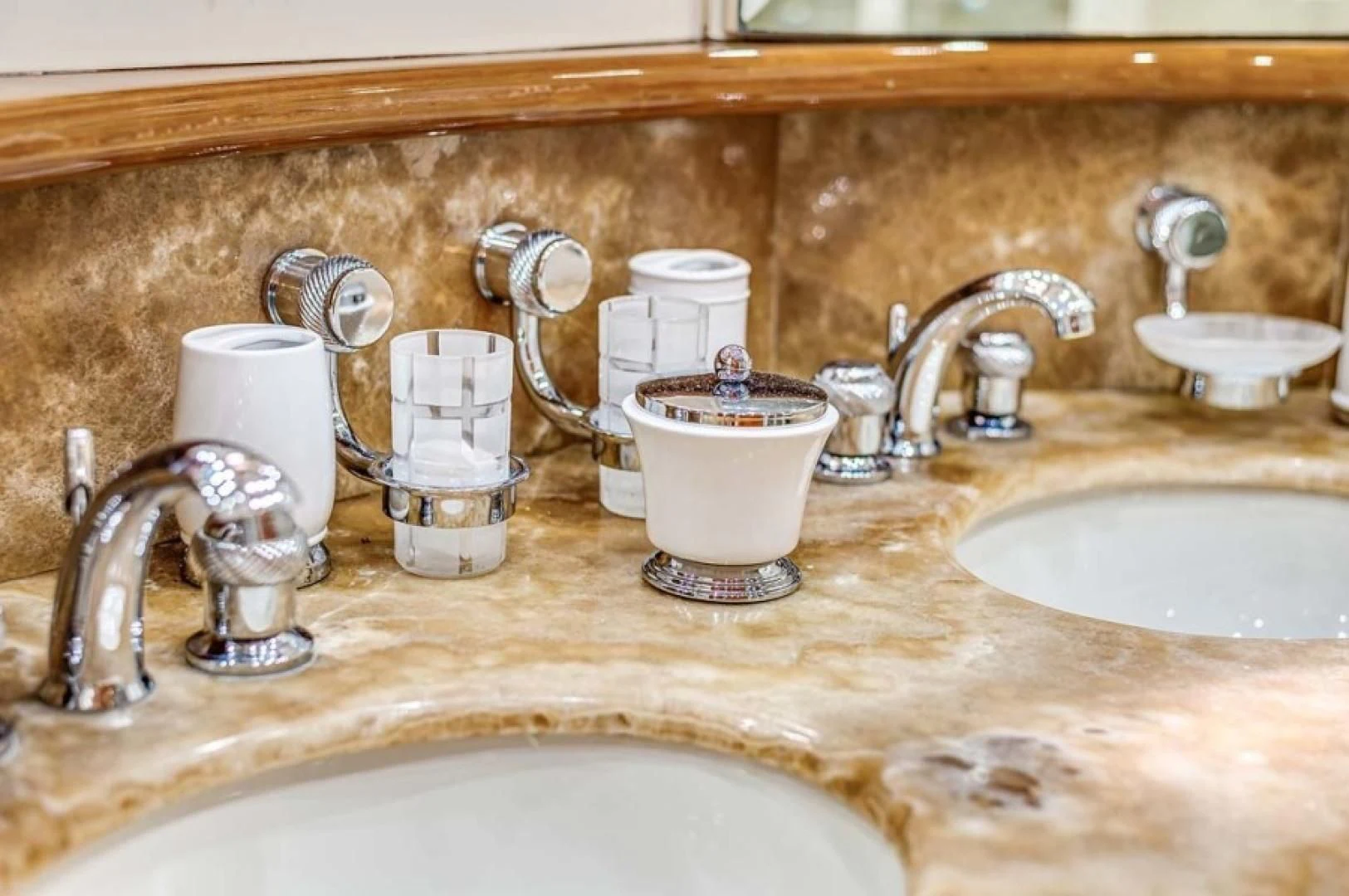 a bathroom sink with a tea kettle and a faucet aboard THE CURE Yacht for Sale