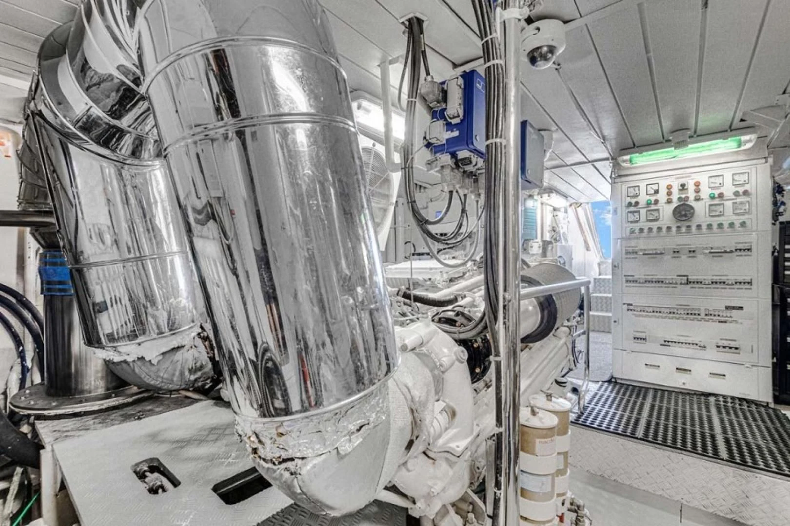 a large white machine with a large metal cylinder aboard THE CURE Yacht for Sale