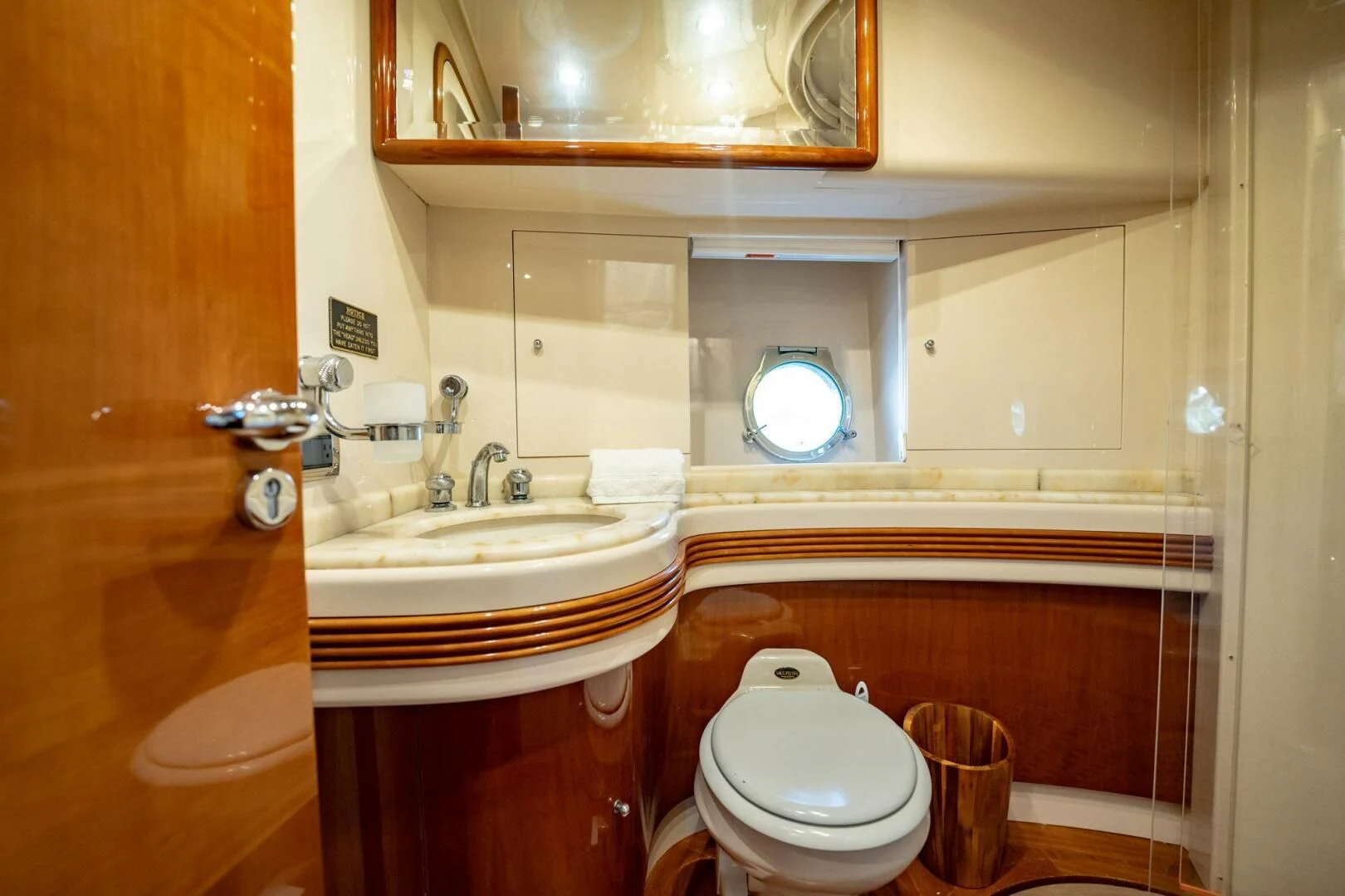 a bathroom with a toilet and a sink aboard THE CURE Yacht for Sale