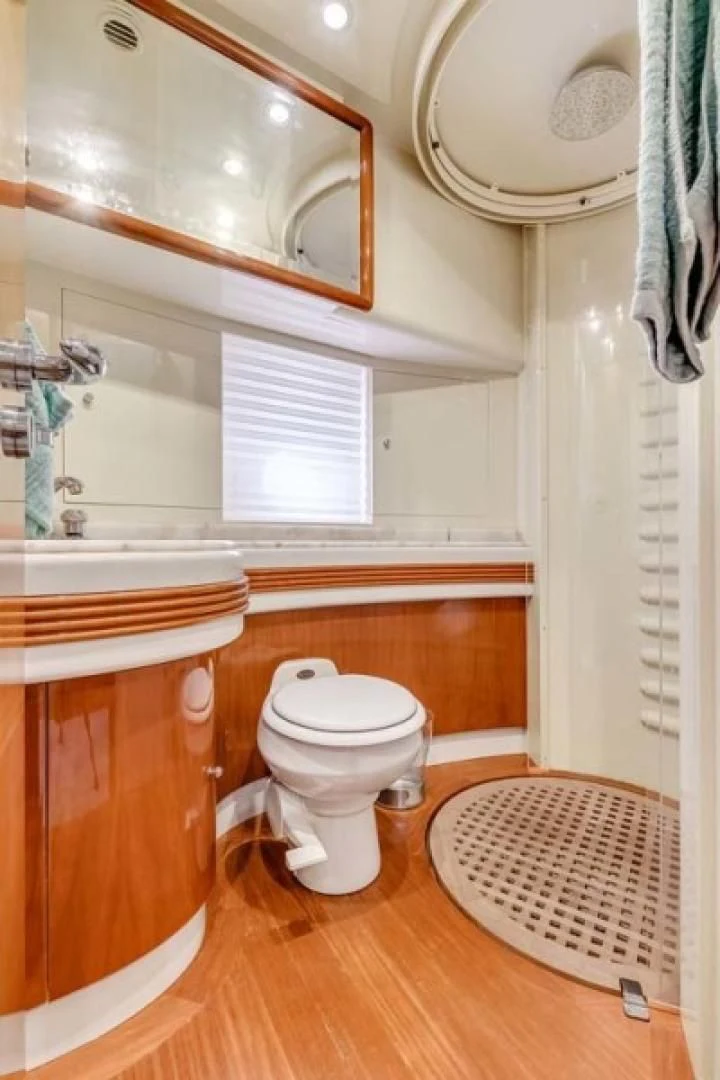 a bathroom with a toilet and a sink aboard THE CURE Yacht for Sale