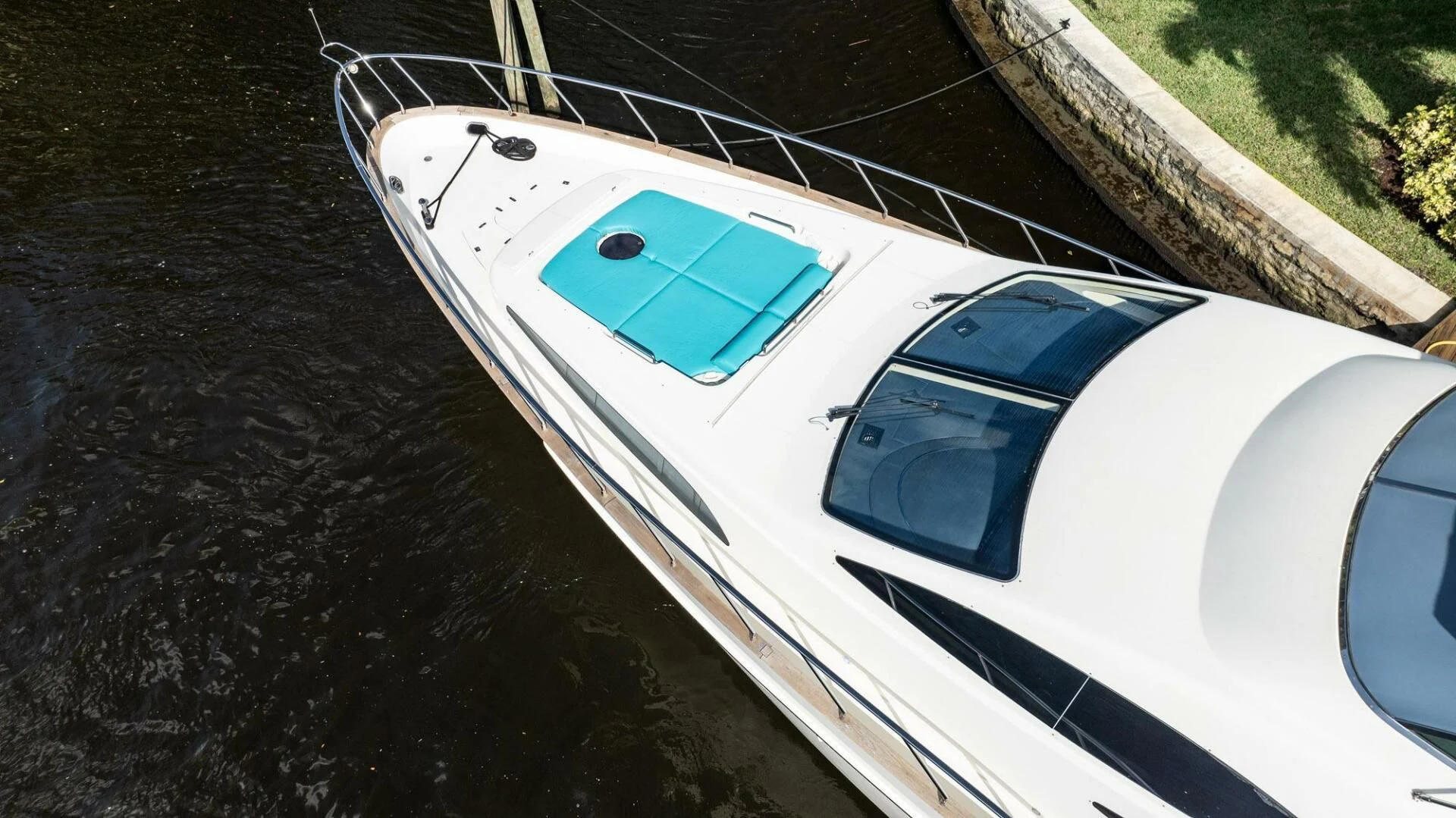 a white boat on water aboard THE CURE Yacht for Sale