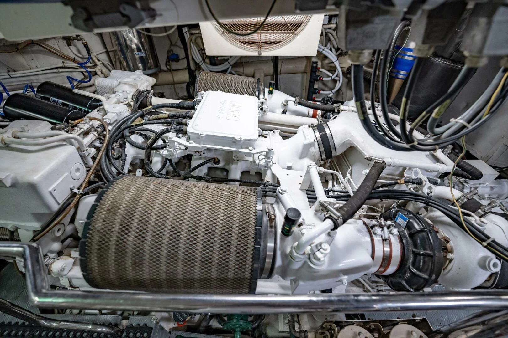 a car engine with a white cylinder aboard THE CURE Yacht for Sale