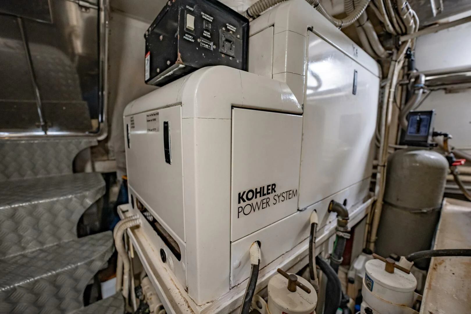 a large white machine aboard THE CURE Yacht for Sale