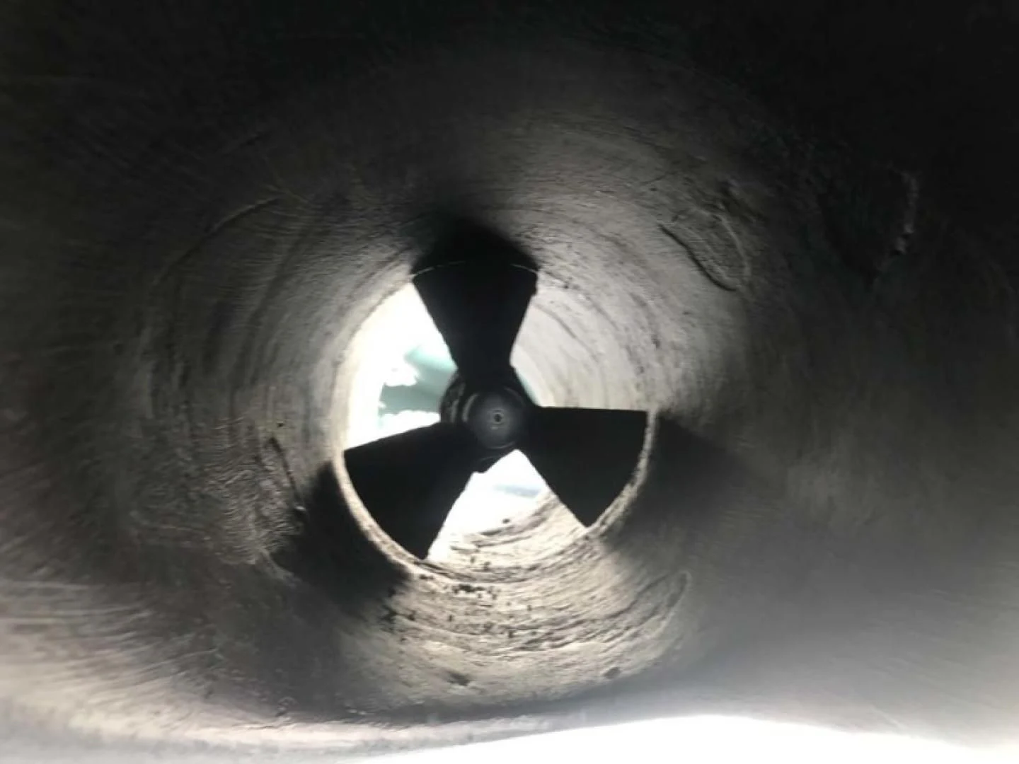 a person in a tunnel aboard THE CURE Yacht for Sale
