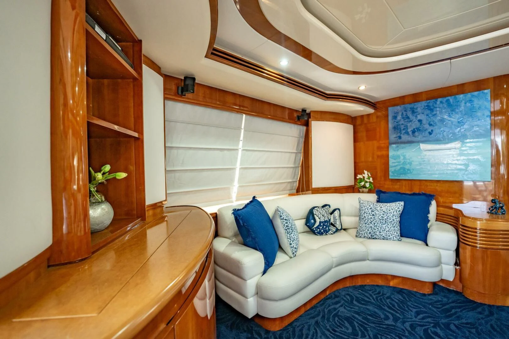 a white couch in a room aboard THE CURE Yacht for Sale