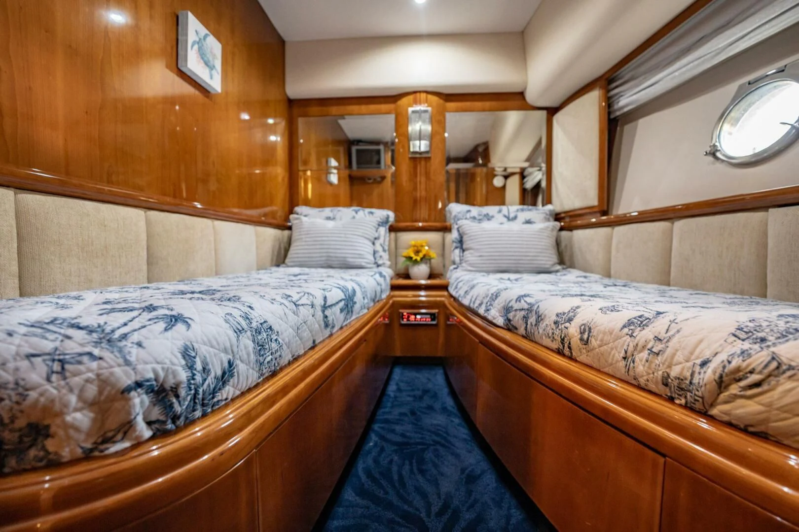 a room with two beds aboard THE CURE Yacht for Sale