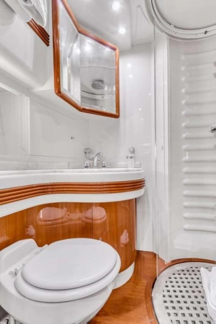 a bathroom with a toilet and sink aboard THE CURE Yacht for Sale