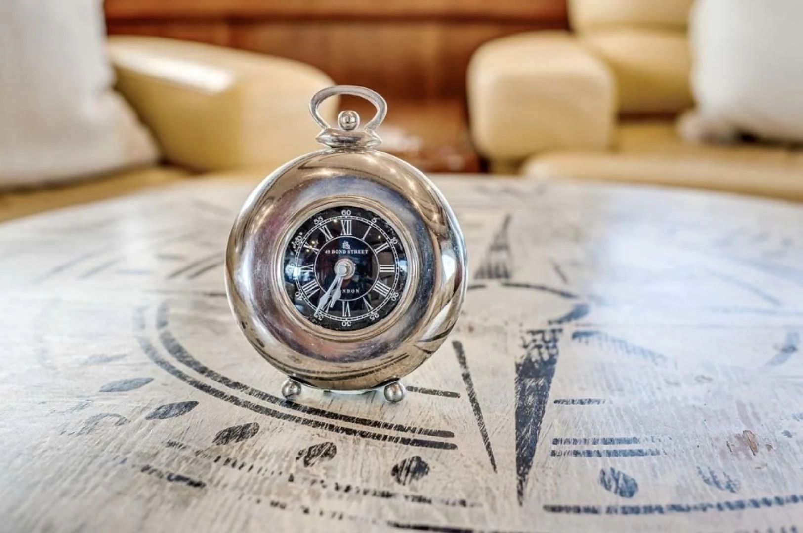 a watch on a map aboard THE CURE Yacht for Sale