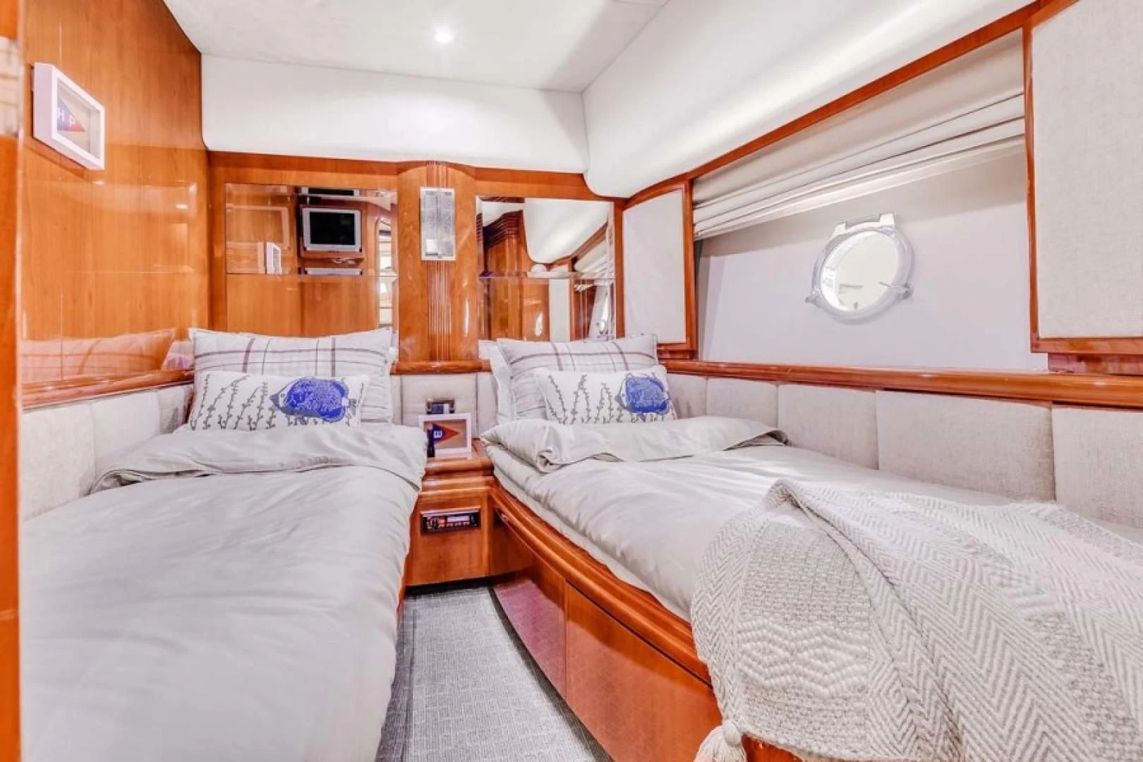 a room with beds and a window aboard THE CURE Yacht for Sale