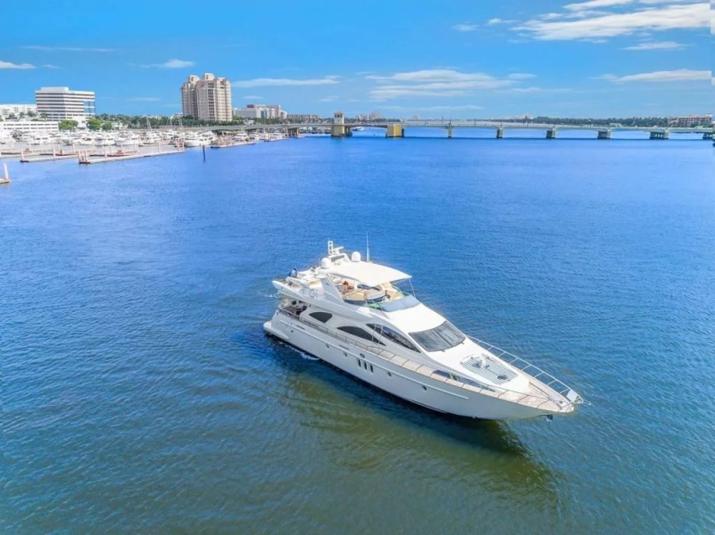 a white yacht in the water aboard THE CURE Yacht for Sale