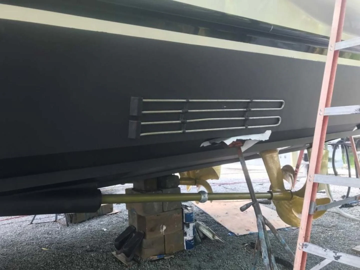 a cat under a car aboard THE CURE Yacht for Sale