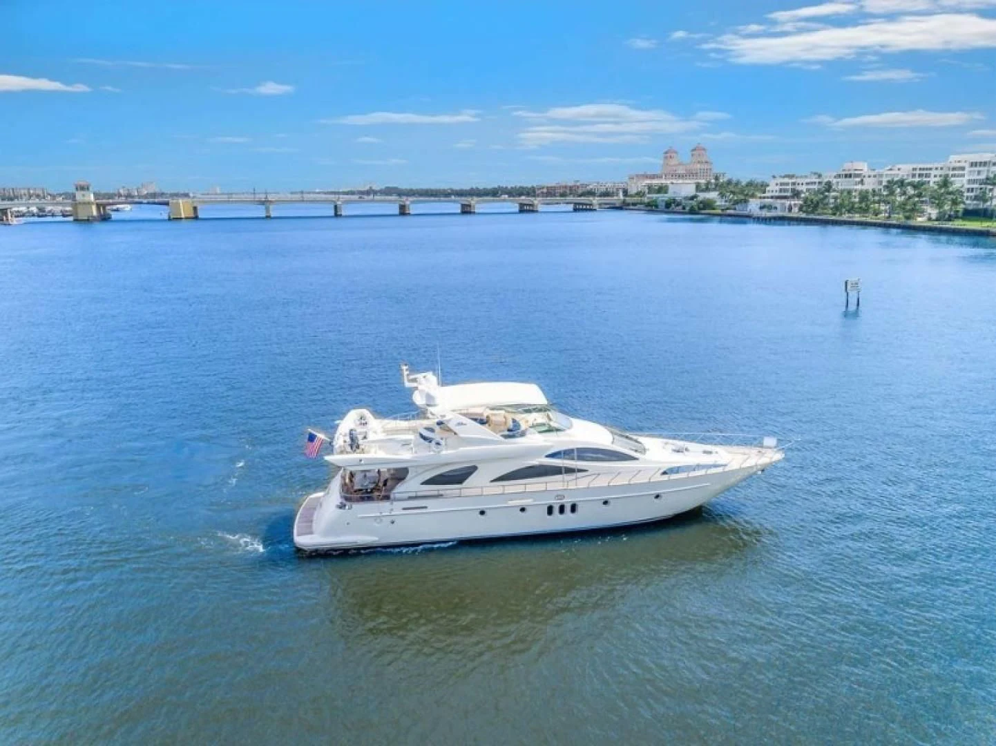a white boat on the water aboard THE CURE Yacht for Sale