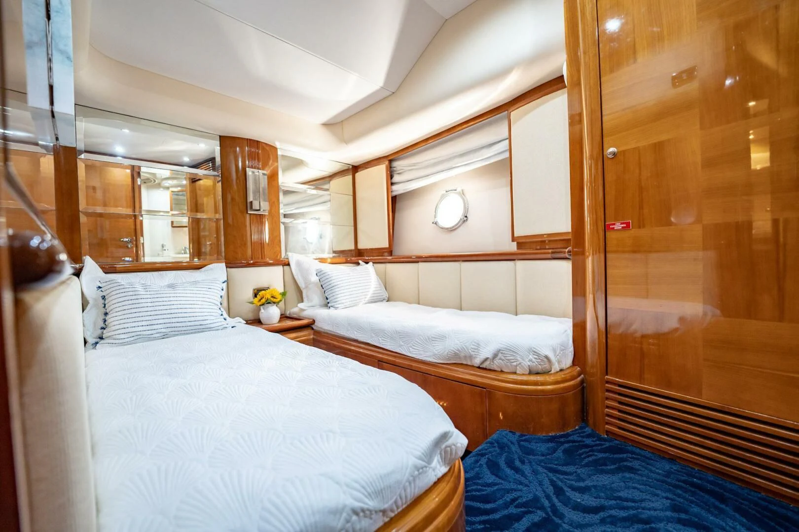 a room with two beds aboard THE CURE Yacht for Sale