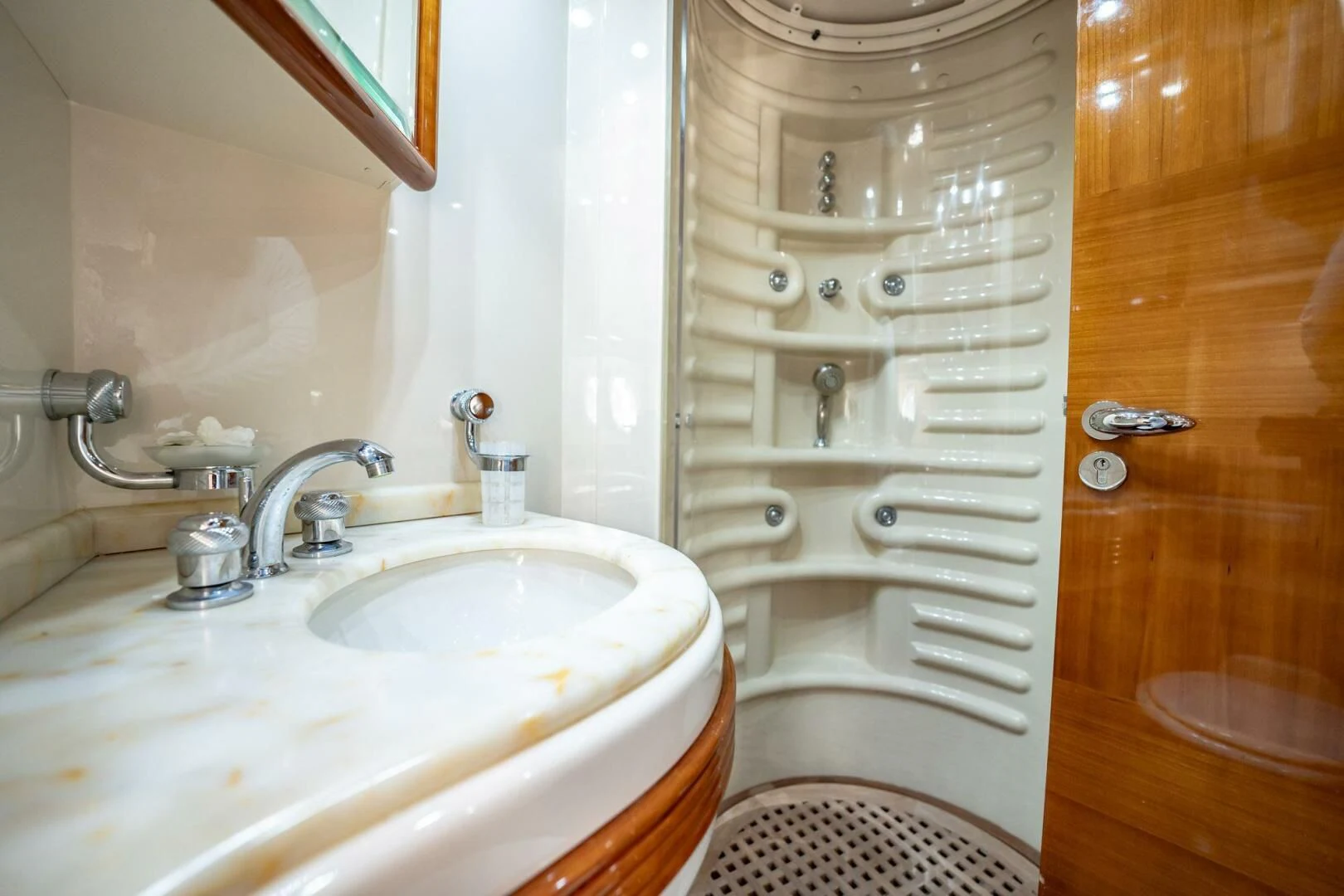 a bathroom with a sink and a shower aboard THE CURE Yacht for Sale