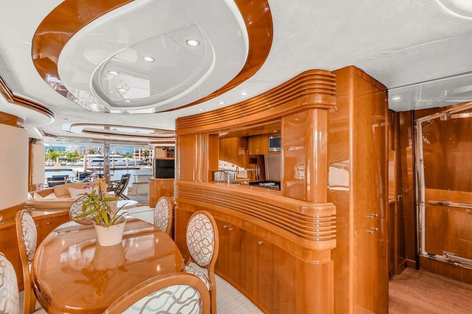 a wooden piano in a room aboard THE CURE Yacht for Sale